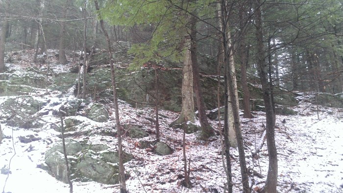 The ledges and boulders to the right in the notch.