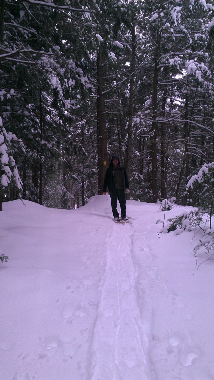 Andrew hiking in the snowshoe path.