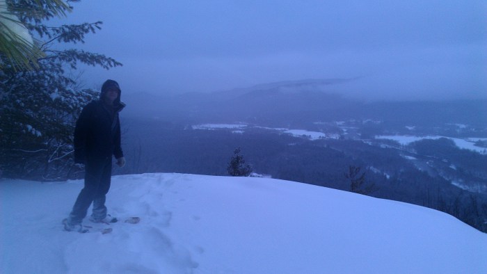 Andrew on the summit of Mount Crag.  Shelburne and the Androscoggin River can be seen below.