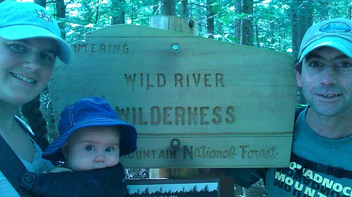 Family photo at the Wilderness sign.