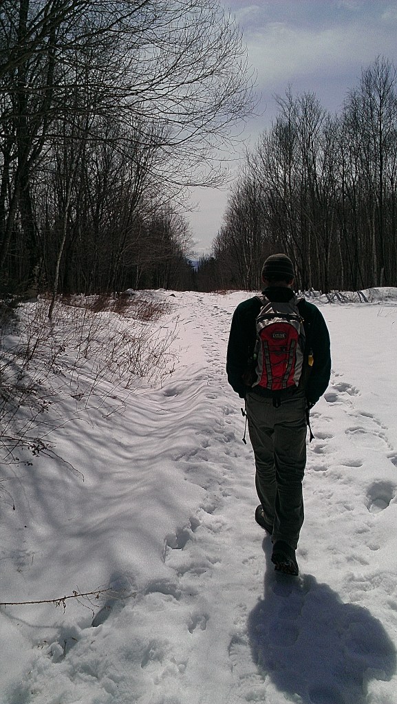 Andrew walks down the trail. 
