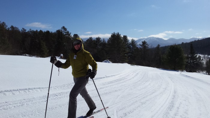 Lindsay skiing with the wonderful view behind her.